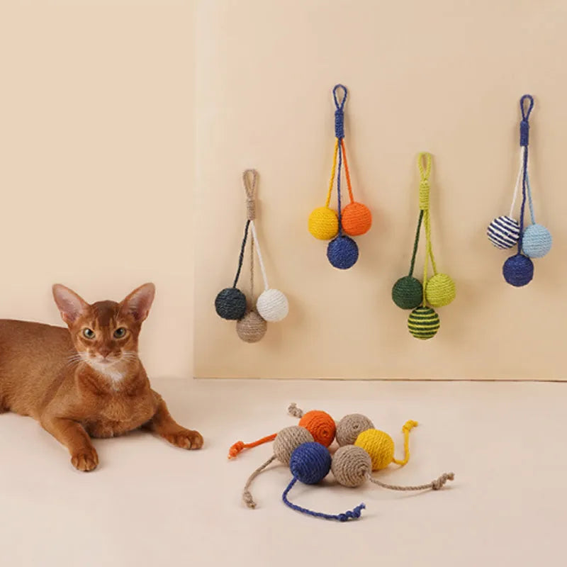 Cat toy set with blue teaser stick and multicoloured catnip ball on white background