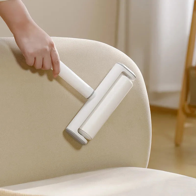 Pet lint remover roller tool with tearable paper sheets for cat hair removal from floors