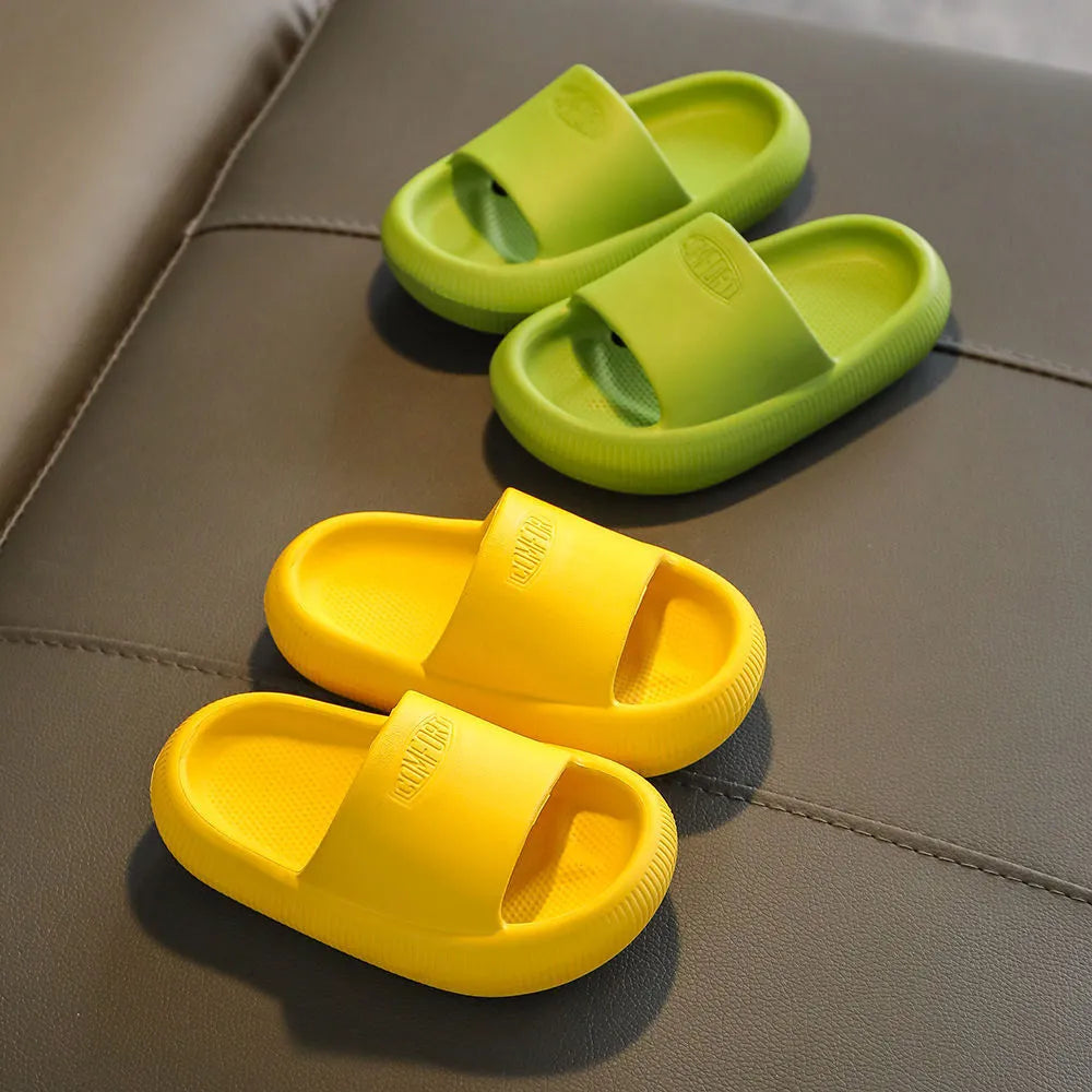 Children's mixed colour EVA slippers with a non-slip sole, shown in blue, green, orange, pink, and yellow.