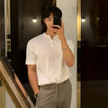 Men's black slim-fit short-sleeved ice silk knitted pullover shirt on a hanger.