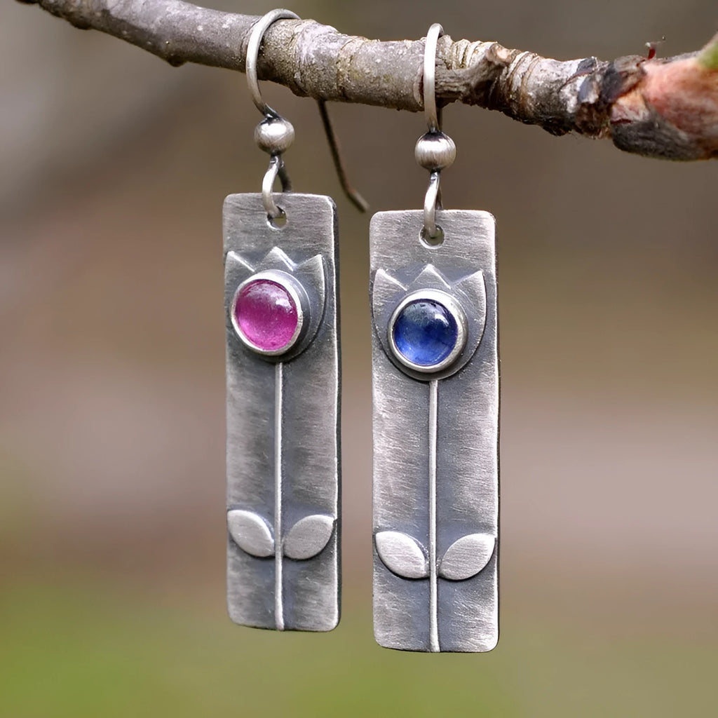 Antique finish red sapphire geometric earrings with ellipse elements and electroplated metal construction