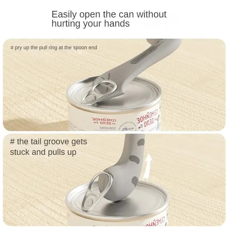 Grey silicone pet food can sealing lid and mixing spoon with integrated can opener on a white background.