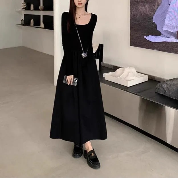 Black square collar long sleeve knitted dress with elastic waist and A-line skirt.