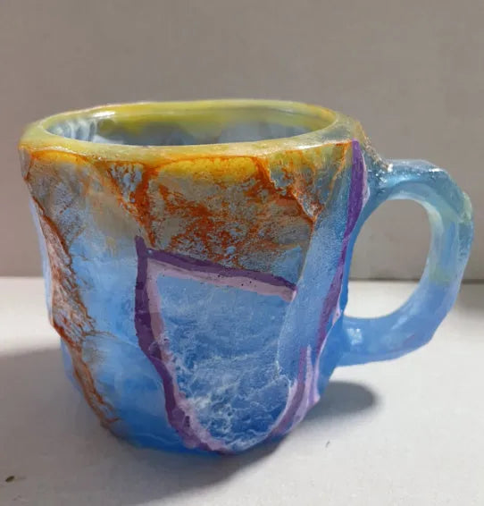 Purple resin mineral crystal coffee mug with handle showing 3D texture and 10cm height