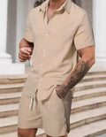 A striped printed casual suit for men, showing the short sleeve shirt and matching shorts on a hanger.