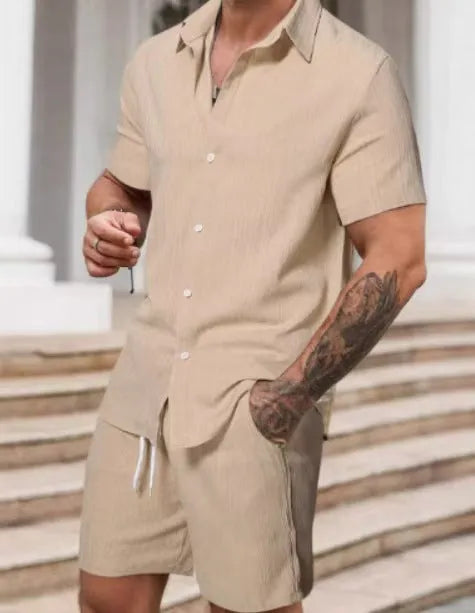 A striped printed casual suit for men, showing the short sleeve shirt and matching shorts on a hanger.