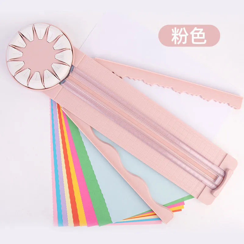Plastic 12-in-1 paper cutting machine in pink or black colours with dotted cutting mechanism