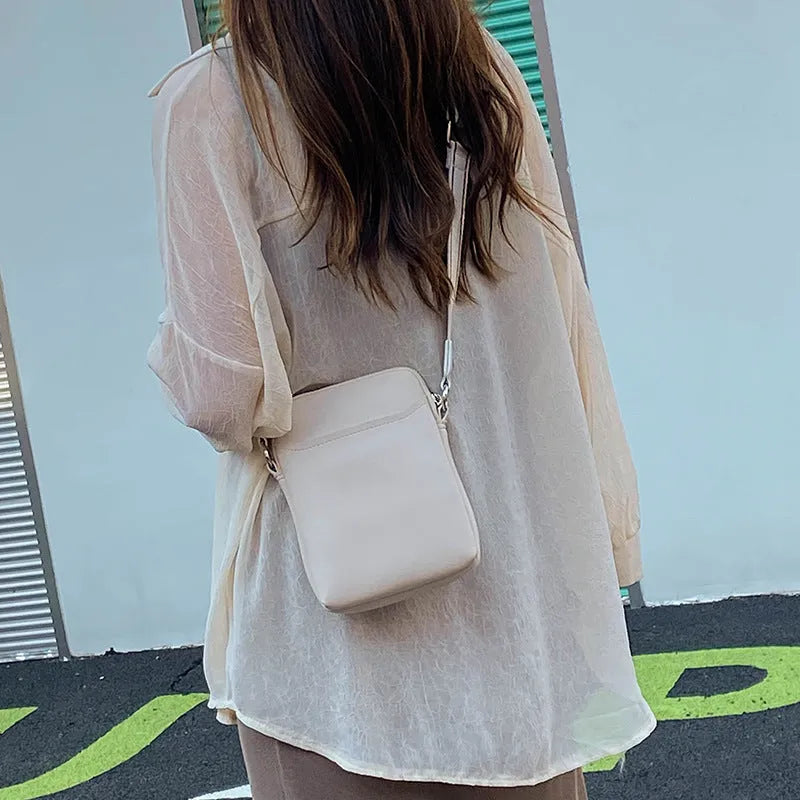 Solid colour mobile phone crossbody shoulder bag in PU material showing front view