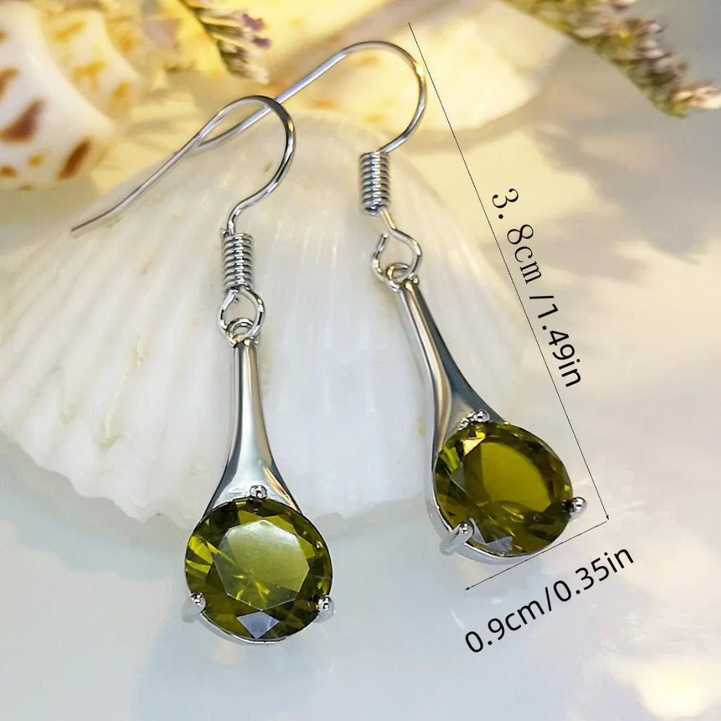 A pair of simple olive green drop-shaped earrings with a retro style on a white background.