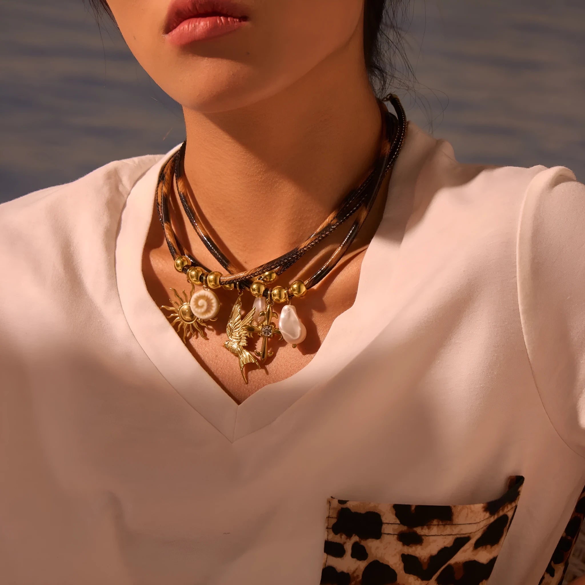 Geometric leopard pendant necklace for women on a stainless steel chain with adjustable length.