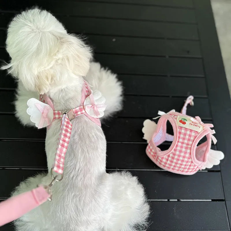 Small dog wearing pink cotton harness with chest and back leash attachment points