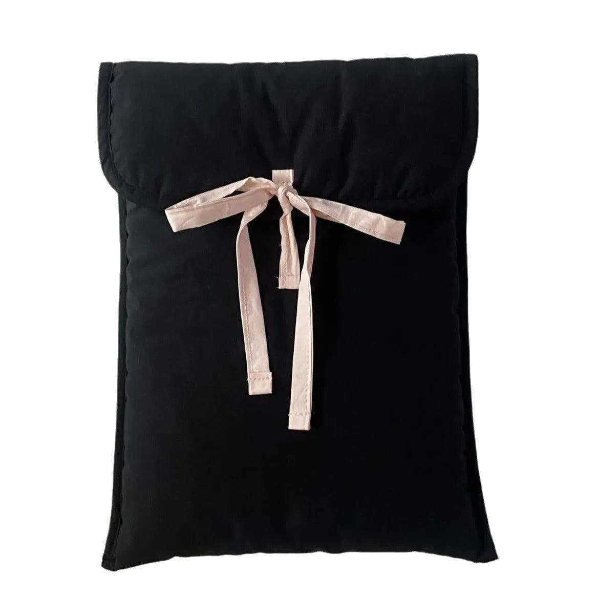 Women's black and white quilted ballet style laptop bag with bow, shown in two sizes.