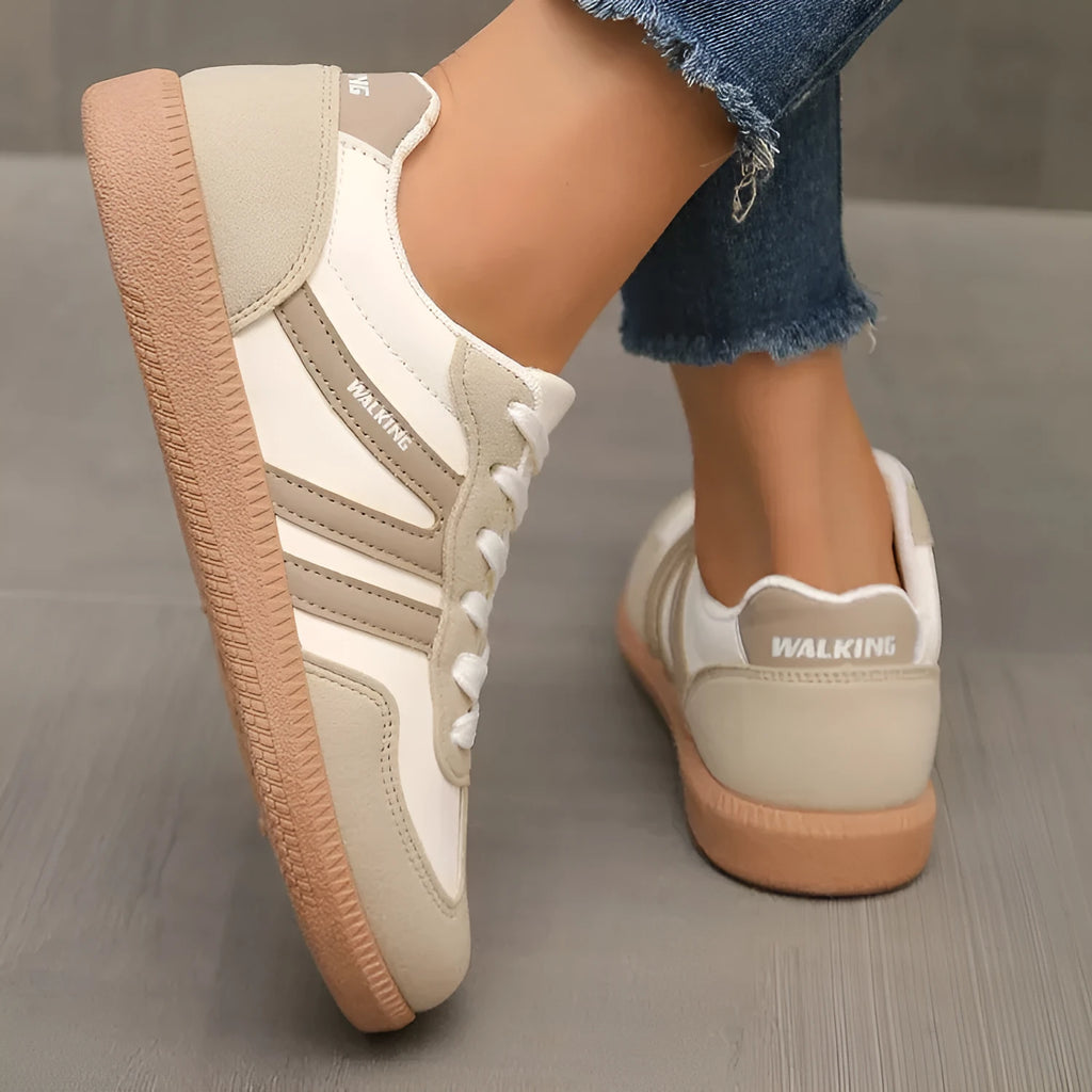 Women's retro casual sneaker in a wine red colour with a round toe, flat rubber sole, and front lace-up fastening.