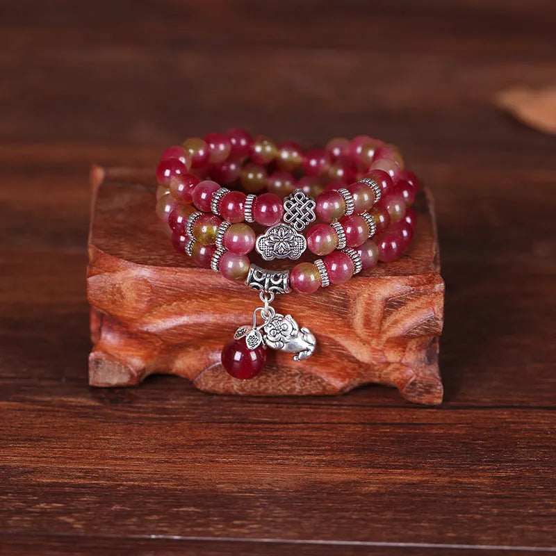 Handmade natural watermelon crystal bracelet with Chinese knot fastening and geometric beads