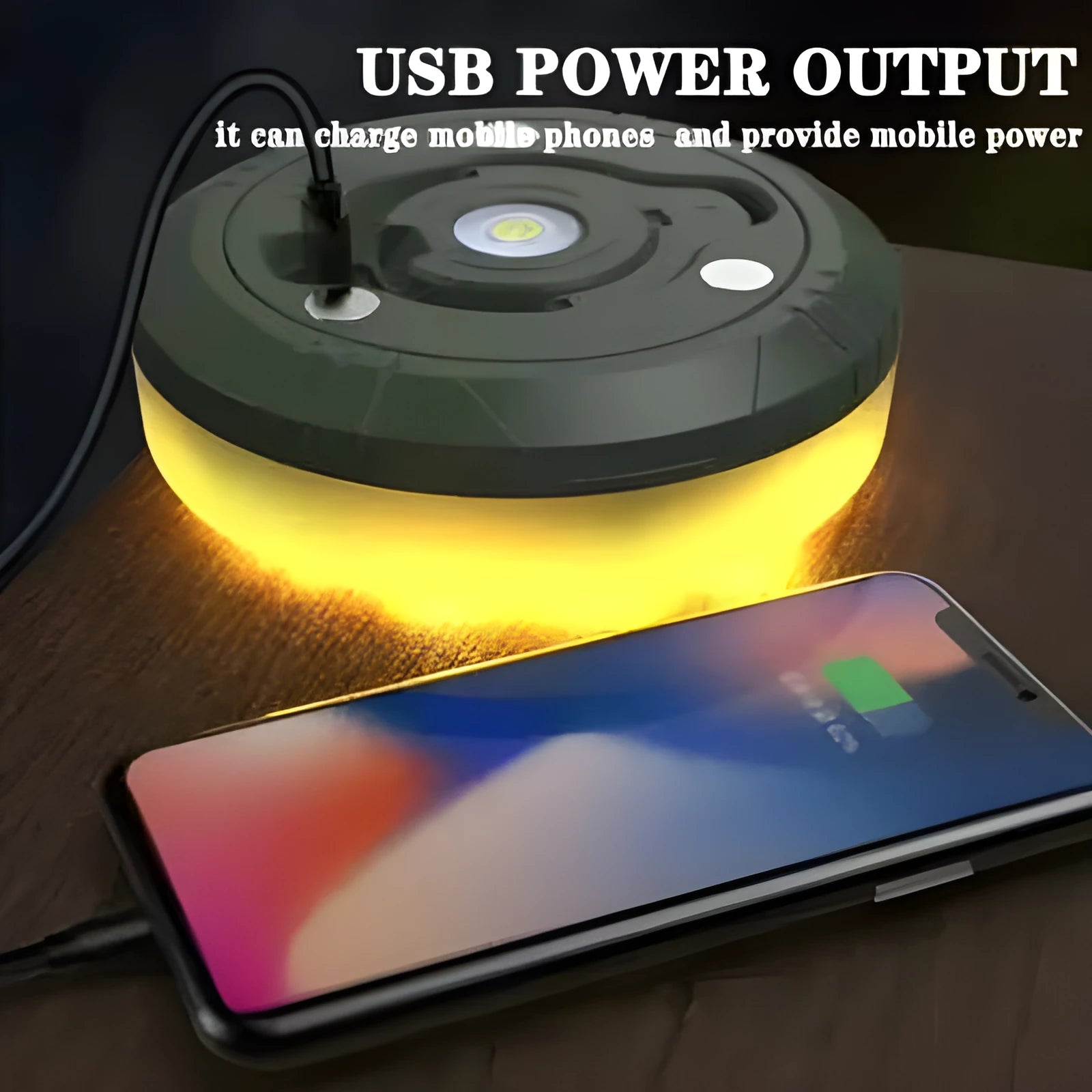Charging multifunctional camping lantern with warm and colourful light modes on a campsite table