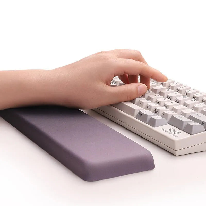 Square silica gel wrist rest mouse pad with cloth top in a choice of colours on a desk.