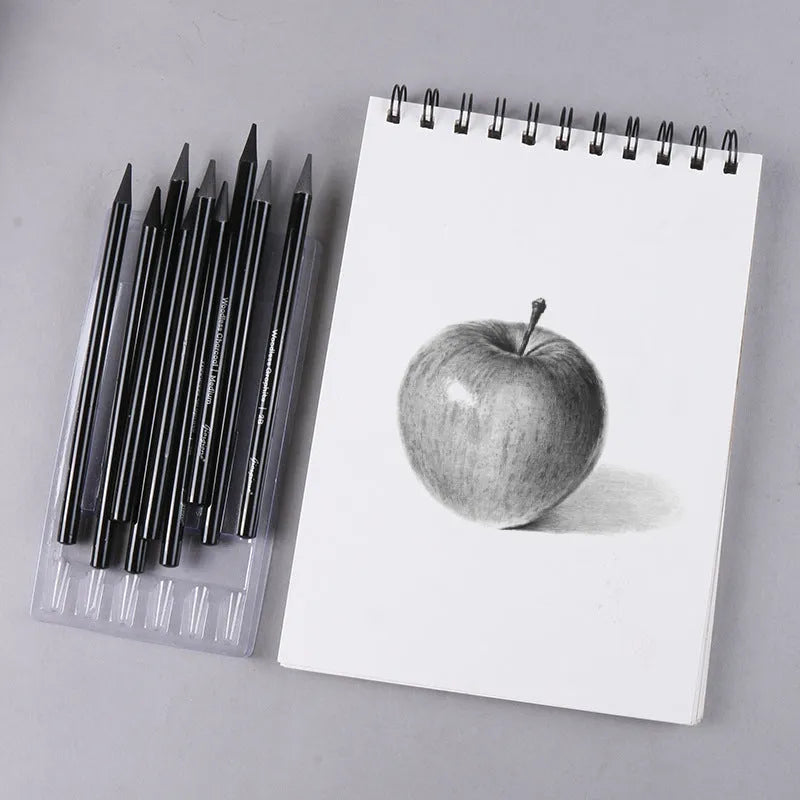 Set of six graphite pencils and three carbonized pencils with wooden shells on suction card packaging