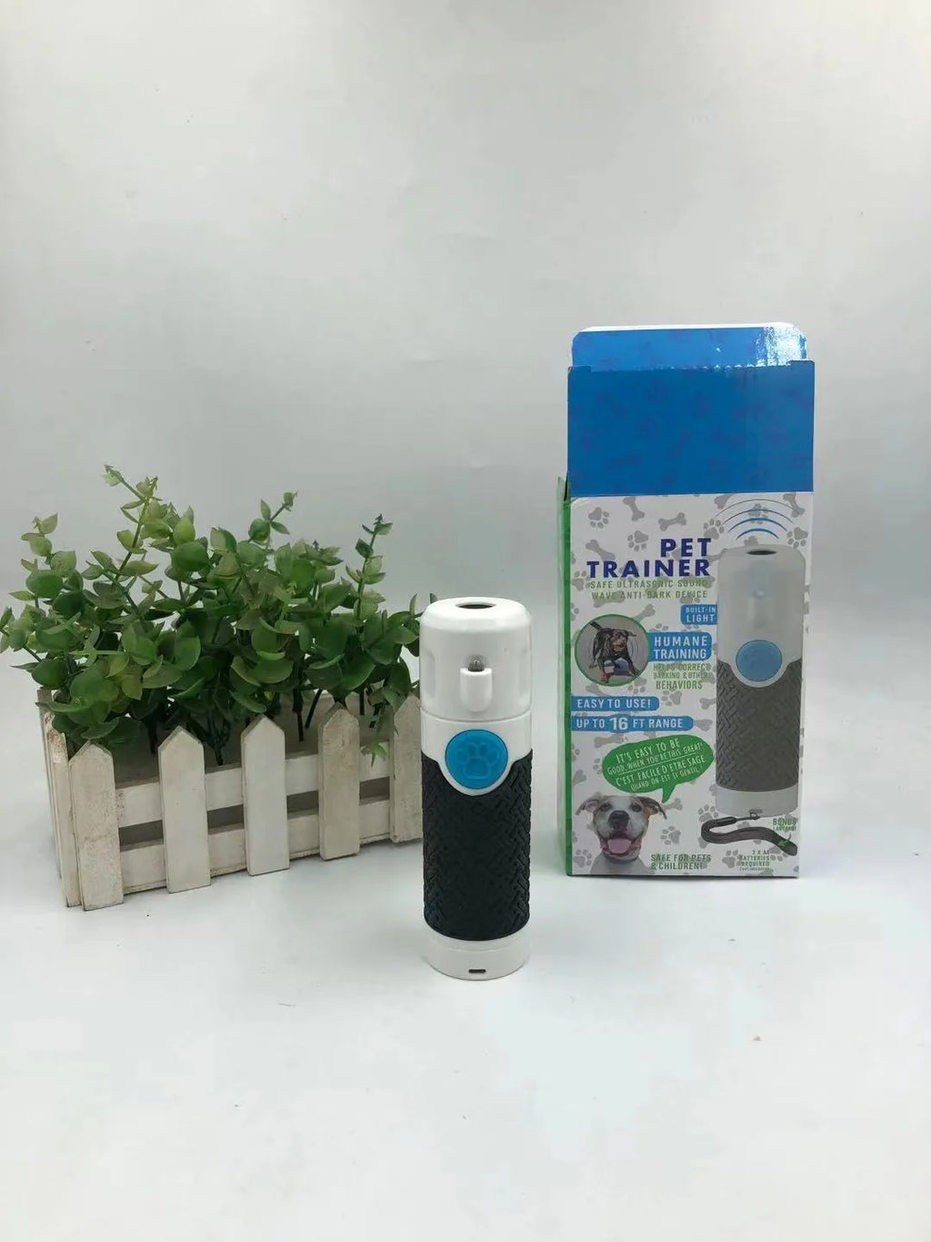 White handheld ultrasonic dog trainer device for bark control and behaviour training