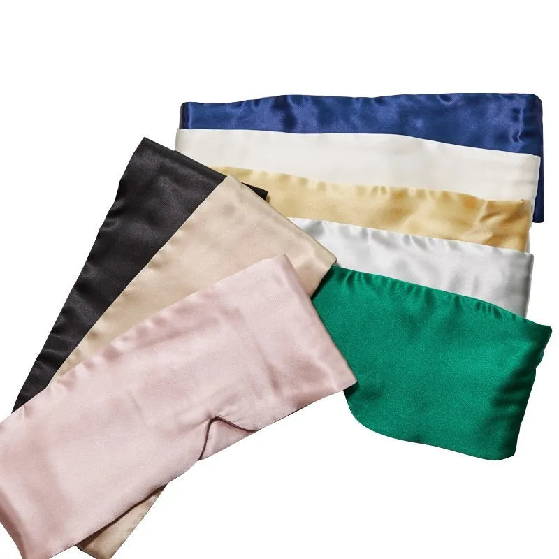 Mulberry silk sleep eye mask shown in multiple colours including black, champagne gold, navy blue, and pink.