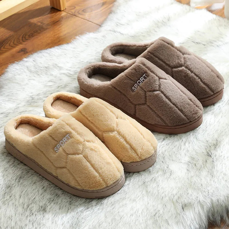 Unisex plush house slippers with white honeycomb-patterned PVC sole, showing round toe and plush inner lining in purple colour