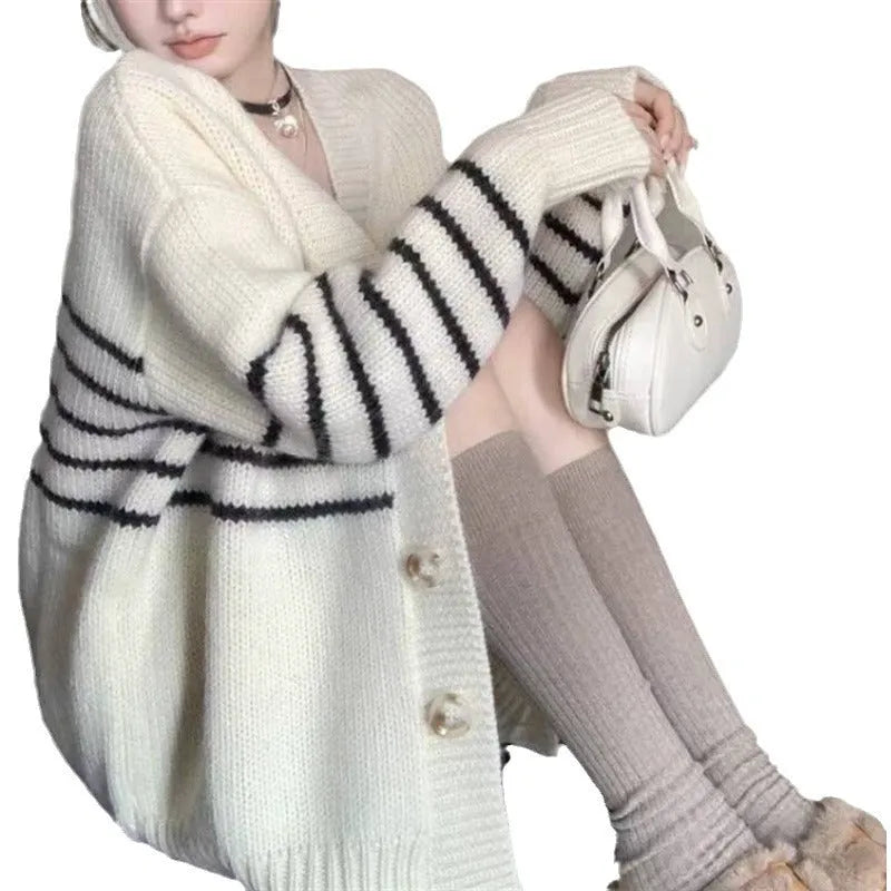 Japanese Korean style cardigan sweater with 3D pattern and button collar on a hanger.