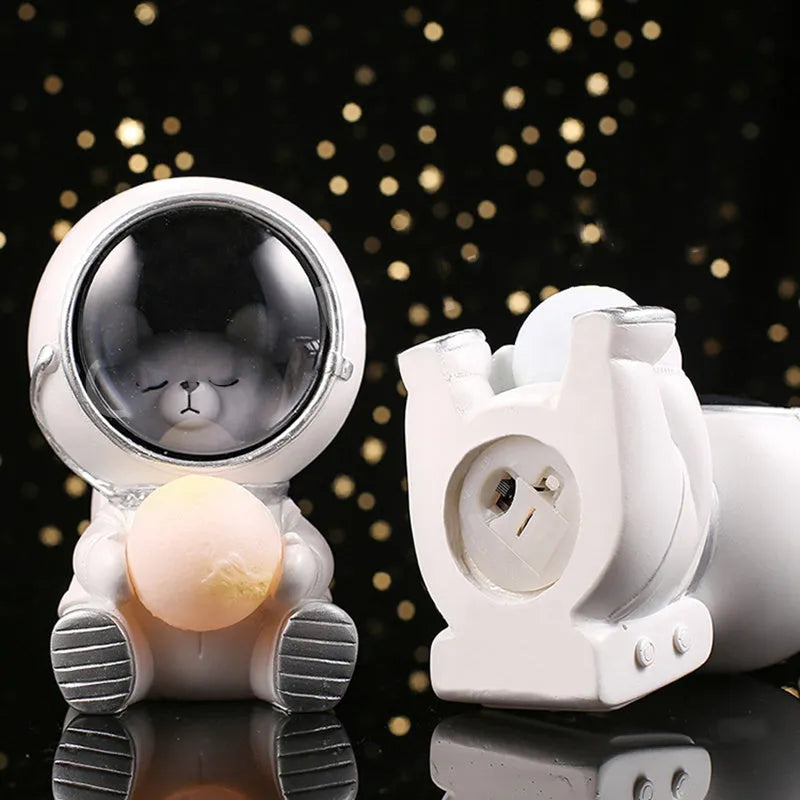 Resin animal night light in bear design with starry sky LED glow on a table.