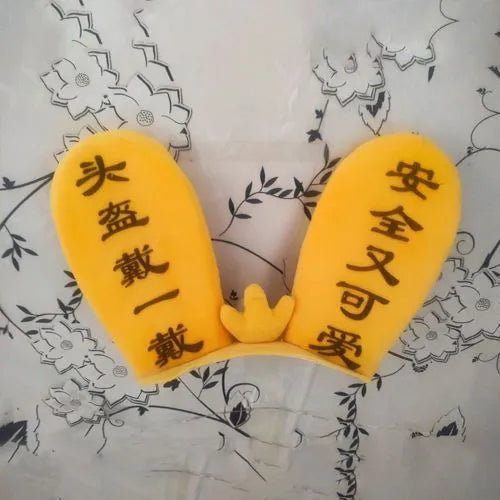 Rabbit glow ears and locomotive themed ski helmet ornament with a Velcro backing.