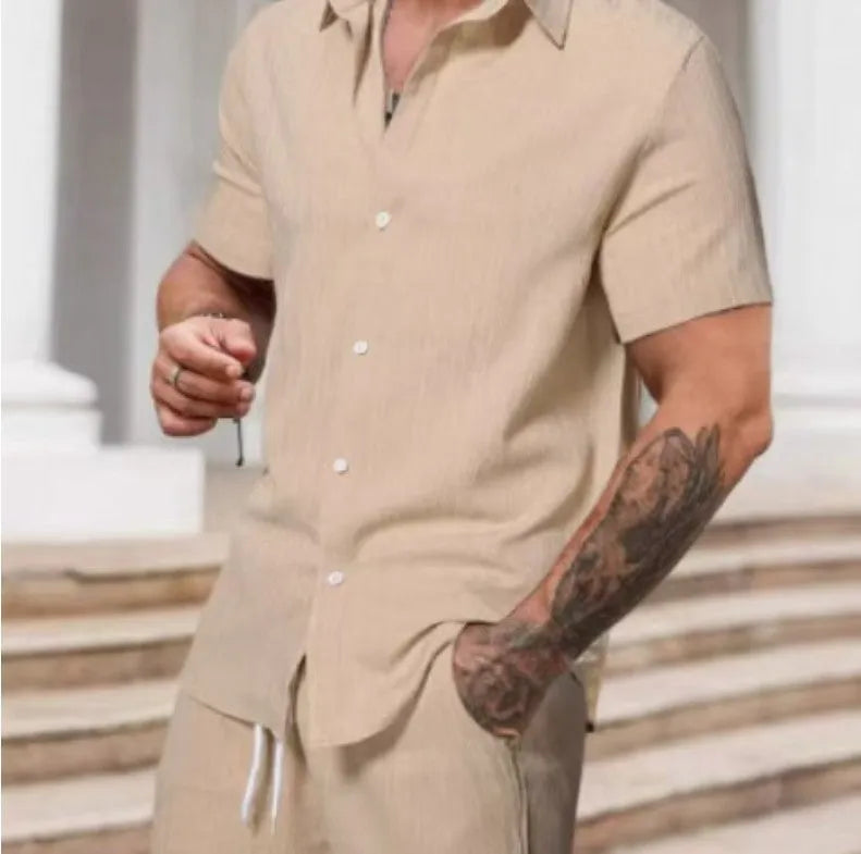 A striped printed casual suit for men, showing the short sleeve shirt and matching shorts on a hanger.