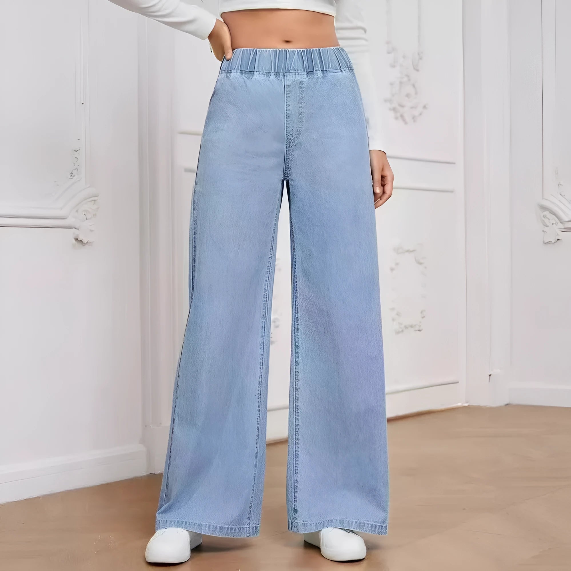 Light blue washed wide-leg straight jeans on a hanger, showing mid waist and zip fly detail.