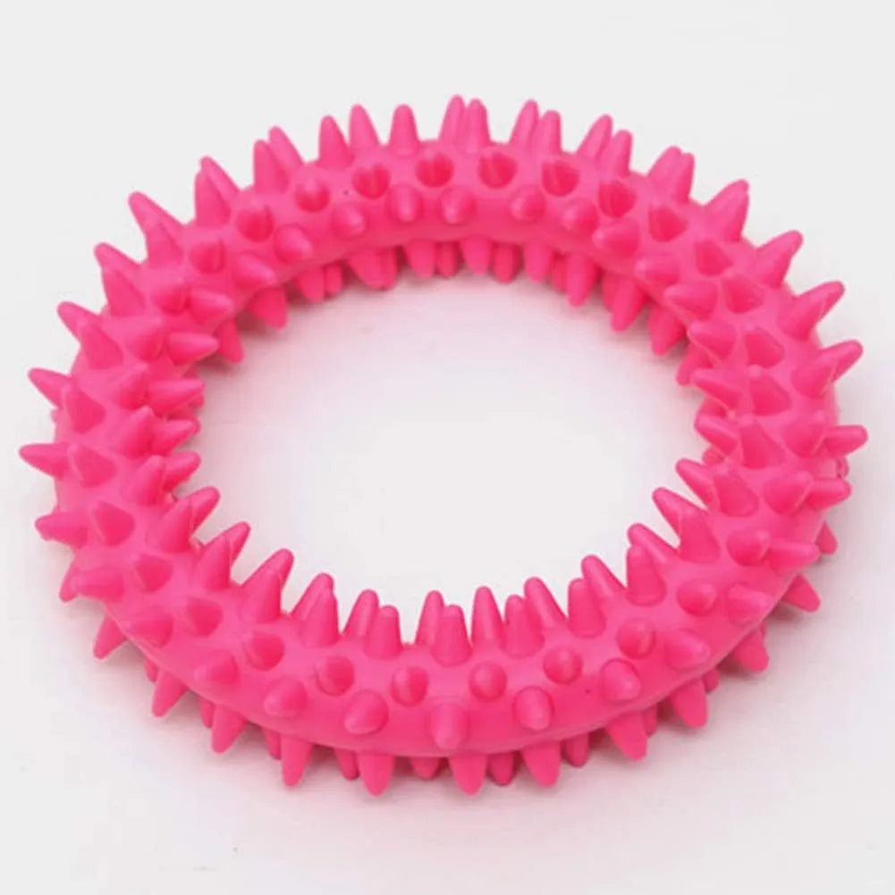 Blue TPR spiked ring dog chew toy for dental cleaning and bite training on a white background.