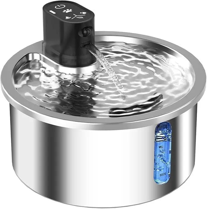 White stainless steel heated pet water fountain with a constant temperature base on a wooden floor.