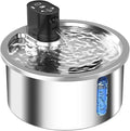 White stainless steel heated pet water fountain with a constant temperature base on a wooden floor.