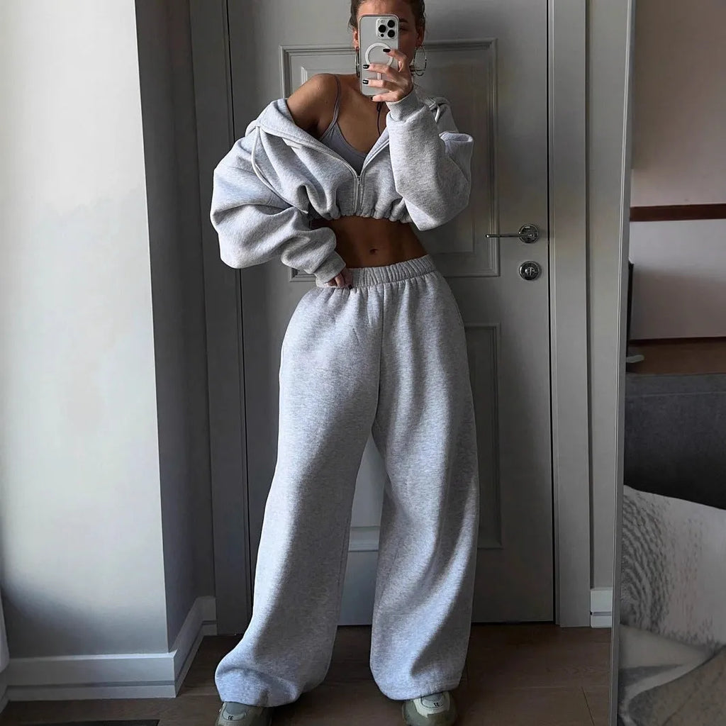 Long sleeve polyester sports sweater suit two-piece set in light grey, showing coat and trousers.
