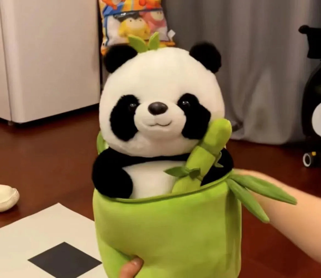 Black and white panda plush doll holding green bamboo tube, soft toy with PP cotton filling