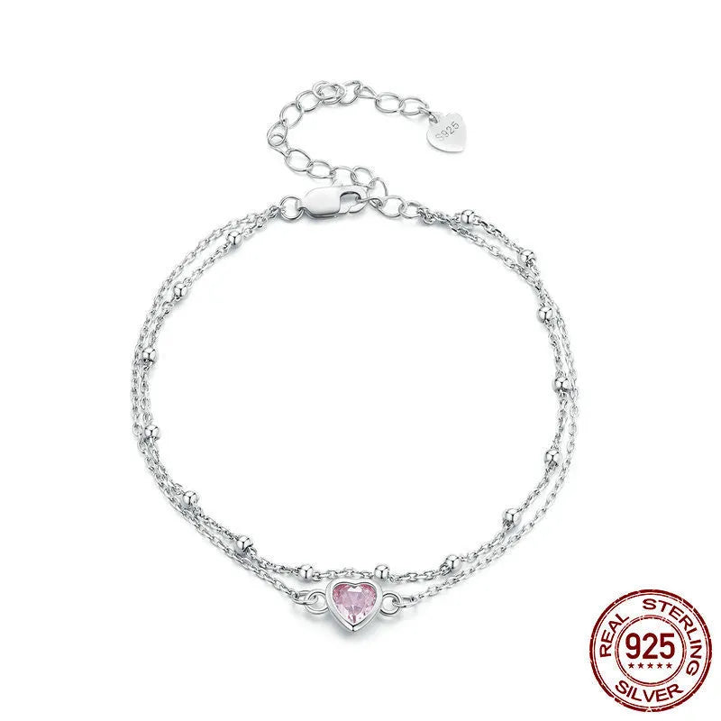 Women's sweet style 925 sterling silver bracelet with small heart charm on an adjustable chain.