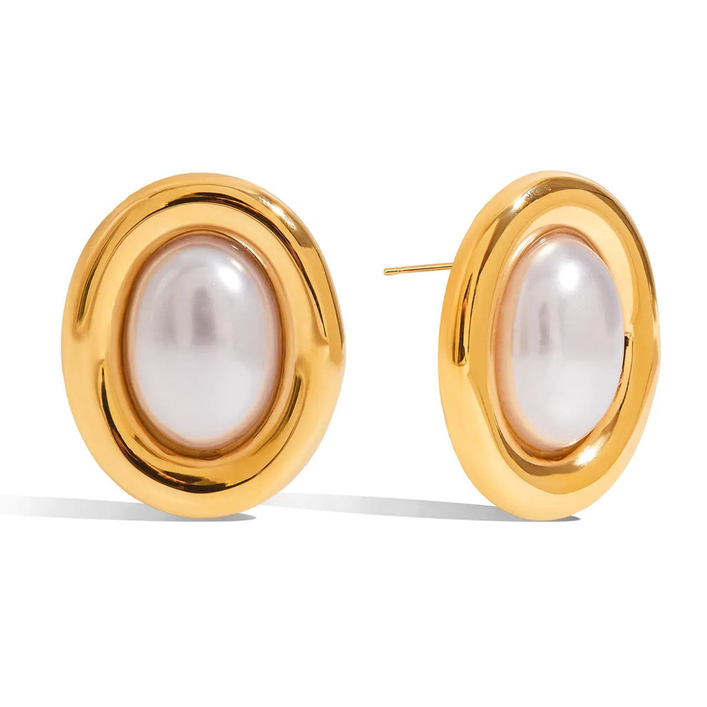 A pair of stainless steel vintage pearl stud earrings with a silver-tone electroplated finish.