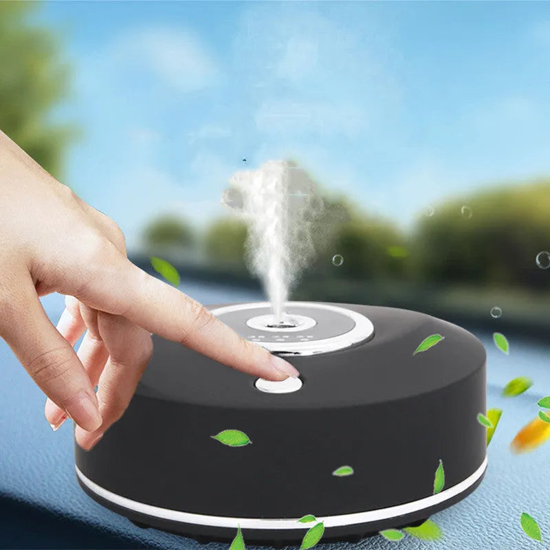 Black USB car perfume holder aromatherapy machine with charging cable on a car dashboard