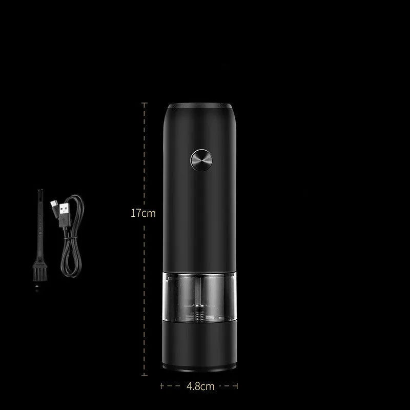 Black and silver electric salt and pepper grinders with clear acrylic bodies on a kitchen counter.