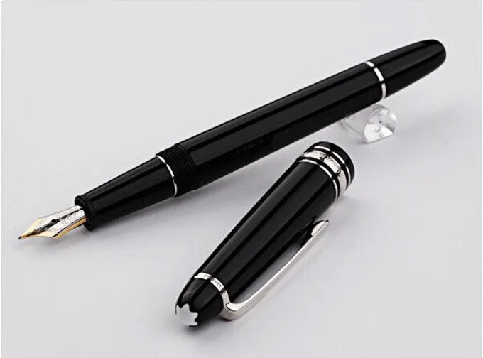 Black fountain pen with gold clip and two-colour nib, 0.7mm iridium tip, on a desk