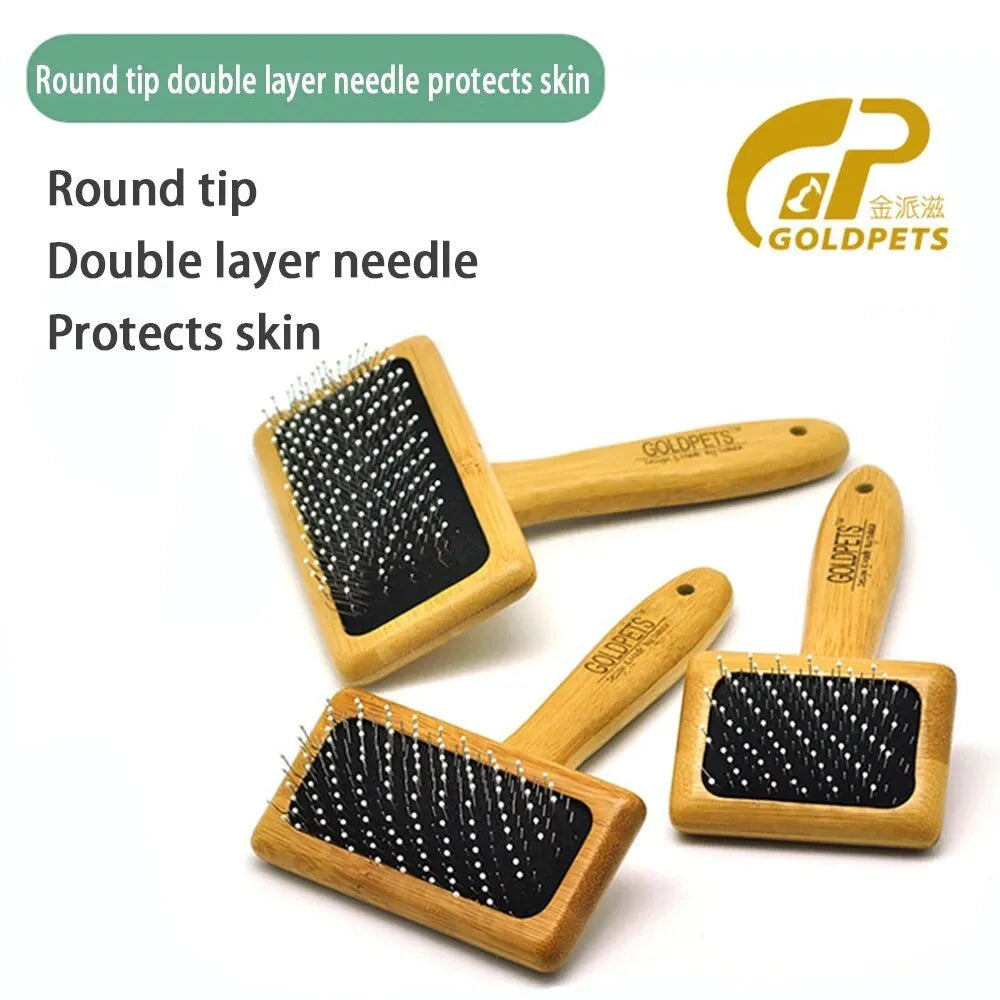 Goldpets bamboo handle pet slicker brush with stainless steel pins on wooden surface