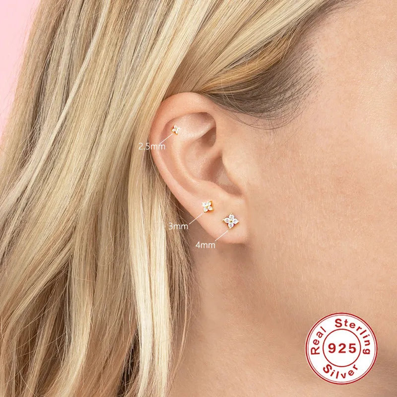 S925 sterling silver petal crystal flowers stud earrings in golden or platinum colour on a white background.