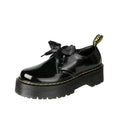Women's black thick soled leather shoes with cross straps and lace-up closure