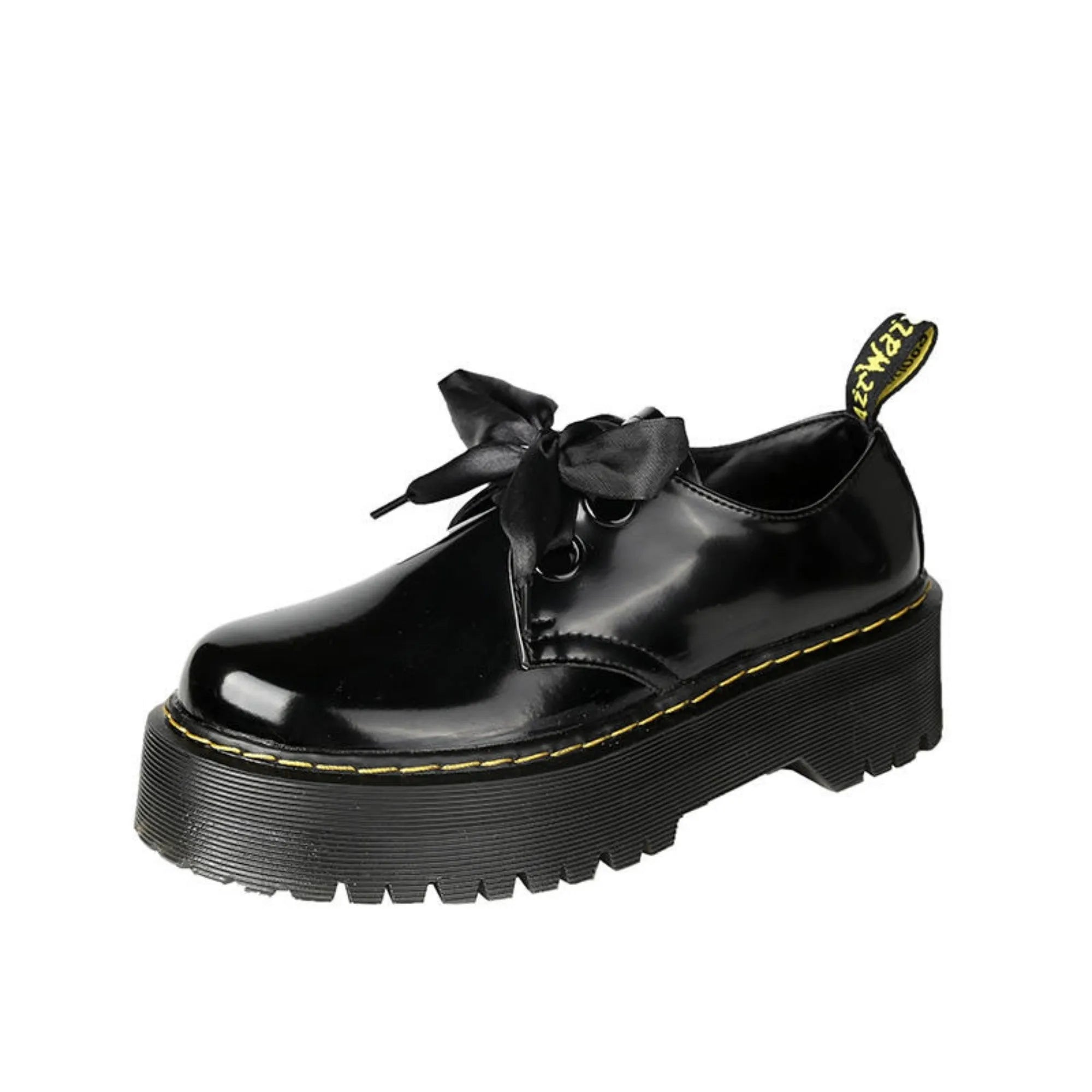 Women's black thick soled leather shoes with cross straps and lace-up closure