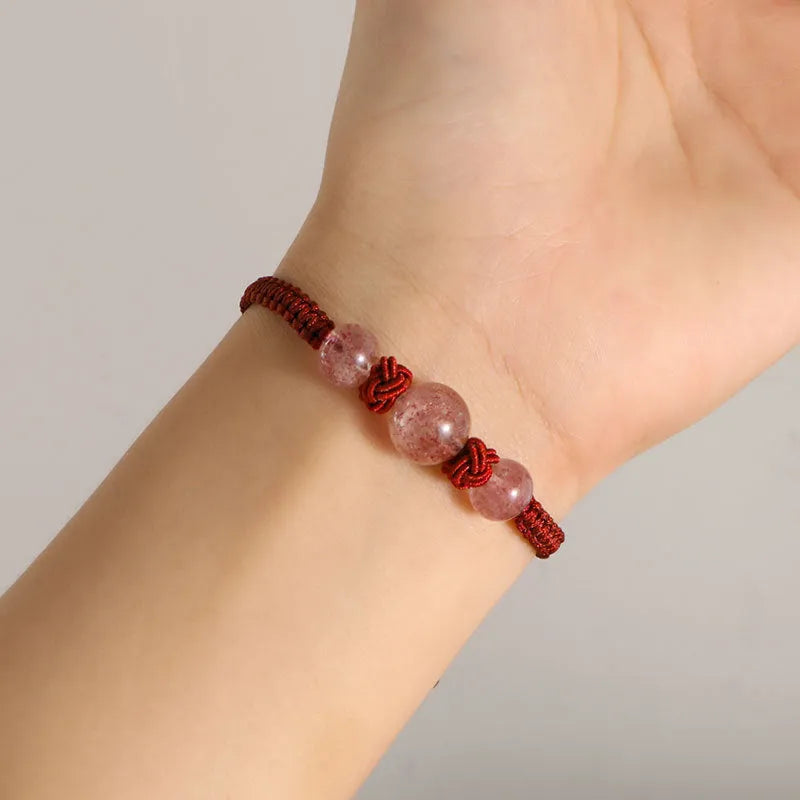 Woven red rope bracelet with spherical natural stone beads and alloy clasp