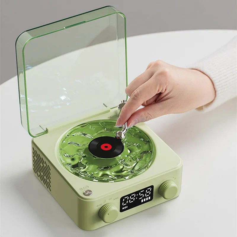 Blue retro-style Bluetooth speaker with rotating transparent turntable and RGB projection lighting