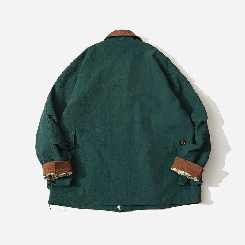 Man and woman modelling a solid green casual polyester jacket with long sleeves and side seam pockets.