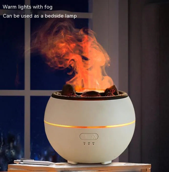 White round desktop flame aroma diffuser and humidifier with USB plug on a wooden table.