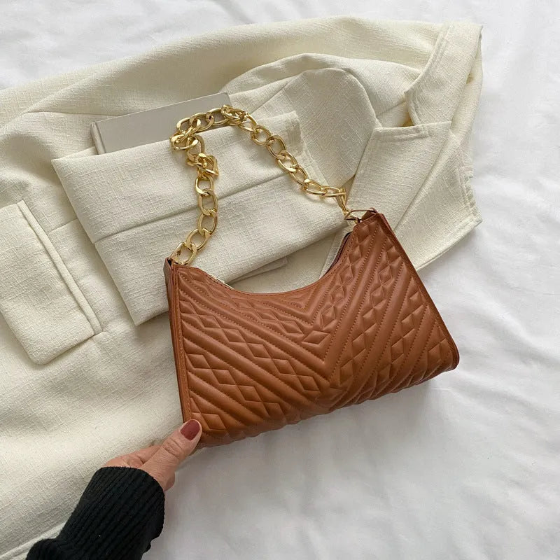 Brown pleated PU leather women's baguette shoulder bag with a chain strap and soft carry handle.
