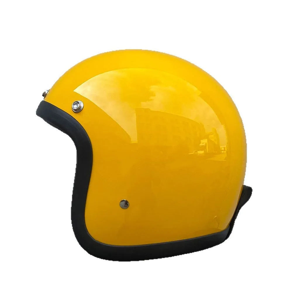 A retro-style fibreglass half motorcycle helmet shown in a cement grey colour, suitable for adult commuting.