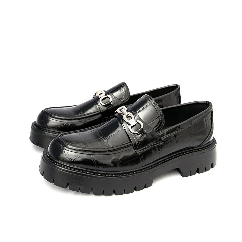 Men's black crocodile pattern leather loafers with a flat heel.